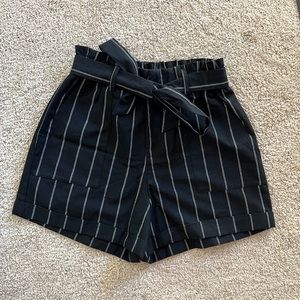Black linen shorts with white stripes
